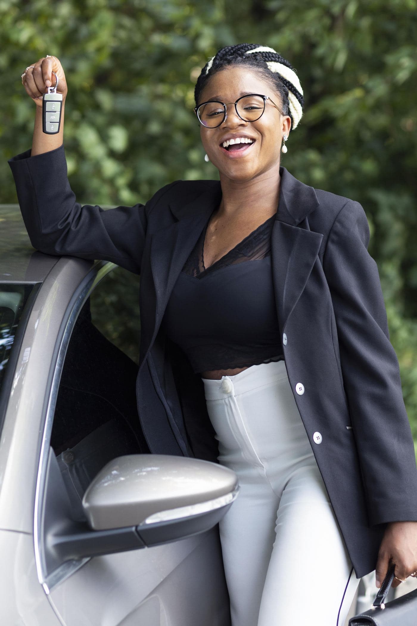 Client holding up the keys to a vehicle